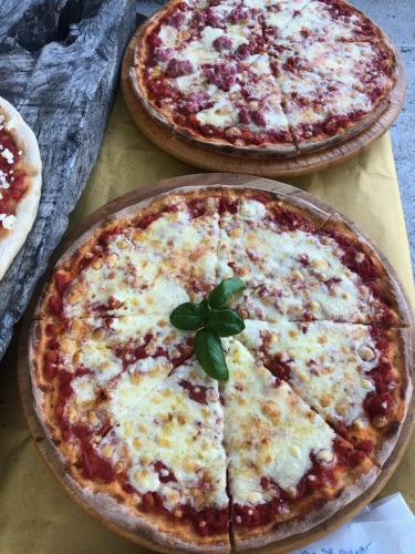 three pizzas sitting on top of a table at Agriturismo Tripala in Minucciano