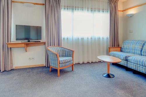 TV a/nebo společenská místnost v ubytování VIP Executive Eden Aparthotel