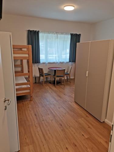 a room with a table and chairs and a dining room at Gästehaus Hebalm, Family & Friends auf 900 m2 Wohnfläche erleben, Alleinnutzung möglich in Pack