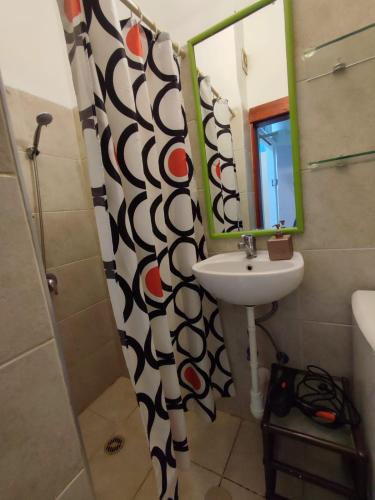 a bathroom with a sink and a mirror at Квартира в непосредственной близости от моря и пляжа в Хайфе /Apartment near the sea and the beach in Haifa in Haifa