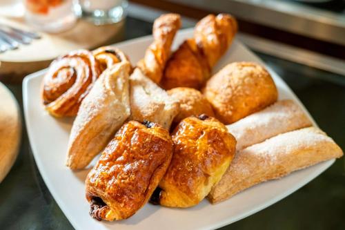 a plate of food with pastries on a table at Hyatt Regency Villahermosa in Villahermosa