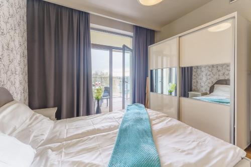 Posteľ alebo postele v izbe v ubytovaní Apartamenty Almar Diune