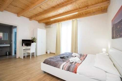 a bedroom with a bed with a teddy bear on it at Romeo&giuliet in Marsala