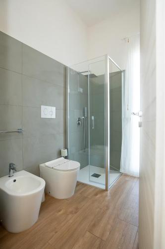 a bathroom with a tub and a sink and a shower at Romeo&giuliet in Marsala