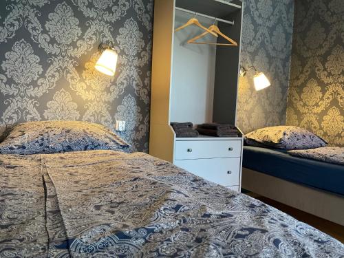 a bedroom with two beds and a mirror at MISVEST Tomasz Klimatyzacja in Zabrze