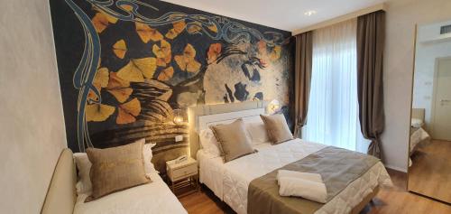 מיטה או מיטות בחדר ב-Amsterdam Suite Hotel & SPA