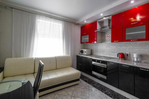 A kitchen or kitchenette at Centralnye Apartments