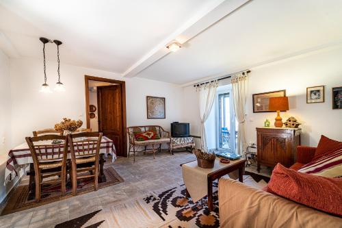 a living room with a couch and a table at VytinaHouse in Vitina