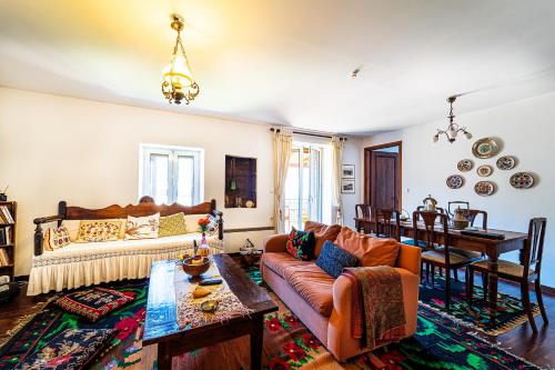 a living room with a couch and a table at VytinaHouse in Vitina