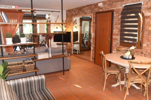 a living room with a table and chairs at Sea La Vie in Volos