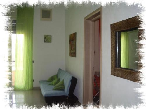 a living room with a couch and a window at B&B del centro storico *** in Rosolini