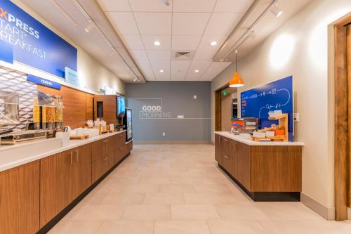 a store lobby with a food ordering counter at Holiday Inn Express & Suites Charlottesville by IHG in Charlottesville