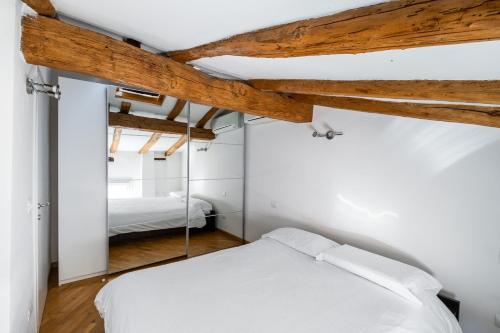 Postel nebo postele na pokoji v ubytování Appartamento Guerrazzi vicino a Palazzo Garganelli