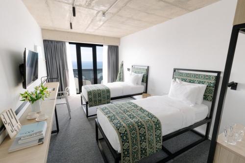 Postel nebo postele na pokoji v ubytování Kartuli Hotel