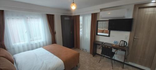 Cama o camas de una habitación en HOTEL GLOBAL 2022