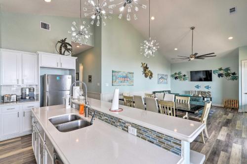 a kitchen and dining room with a dining table at Private Beach and Oceanfront Balcony Freeport Home in Freeport