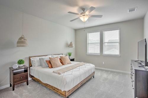 a bedroom with a bed and a ceiling fan at Peninsula Park On-Site Updated Rowlett Home in Rowlett