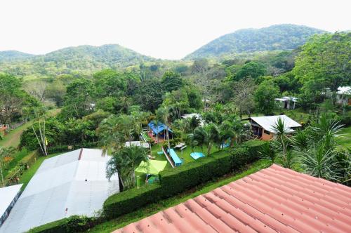 an aerial view of a resort with mountains in the background at Cabañas Ecobiosfera in Catemaco
