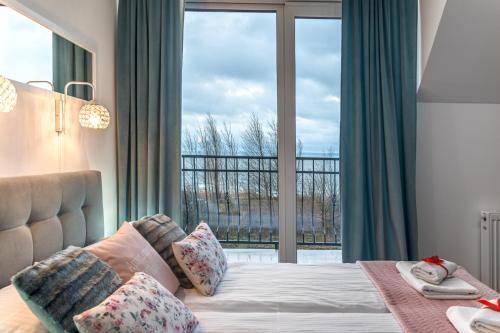 Postel nebo postele na pokoji v ubytování Apartamenty WIKTORIA morska18