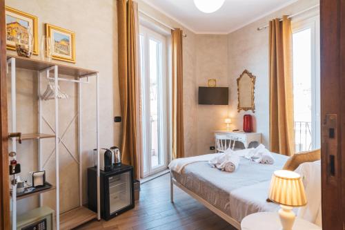 En eller flere senger på et rom på Golden Rooms Piazza di Spagna