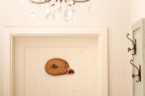 a door with a baseball cap on it at Vila Ana in Štanjel