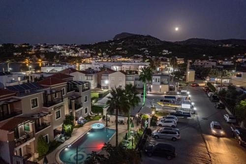 a view of a city at night at Gianna Apartments in Almirida