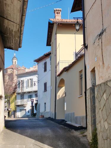an alley in a town with white buildings at Casa Novella in Novello