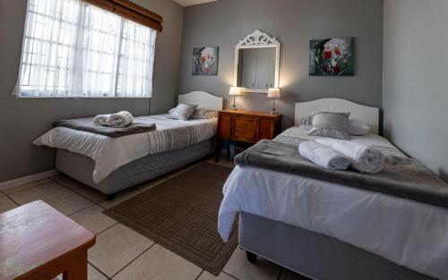 Ένα ή περισσότερα κρεβάτια σε δωμάτιο στο Lyndo's Cove, Close to the WATERFRONT, Nautilus Cove security complex