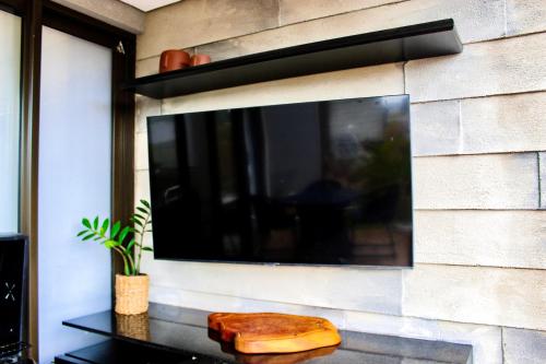 TV a/nebo společenská místnost v ubytování Casa Maldivas em São Miguel dos Milagres