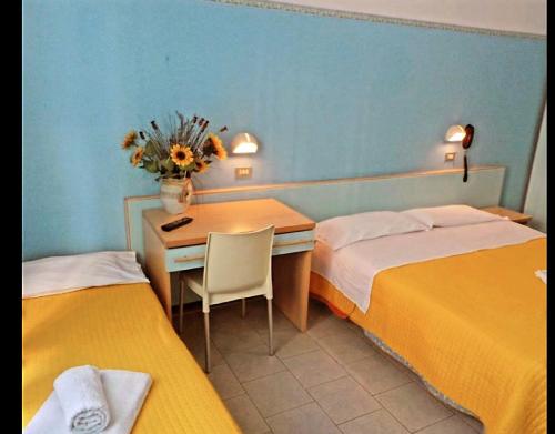 Postel nebo postele na pokoji v ubytování Hotel Silvana Beach