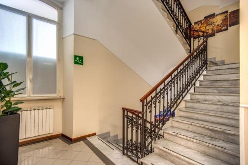 a staircase in a building with a window at Hotel Ottaviano Augusto in Rome