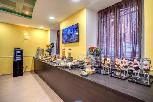 a buffet line in a hotel room with food at Hotel Ottaviano Augusto in Rome