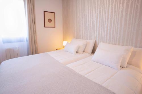 Ένα ή περισσότερα κρεβάτια σε δωμάτιο στο Apartamento A Laxe