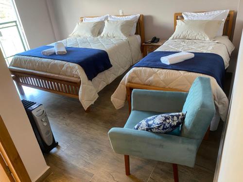 En eller flere senger på et rom på Pousada Alpes Azul