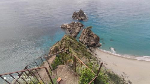 an overhead view of a beach with some rocks at Appartamento City in Palmi