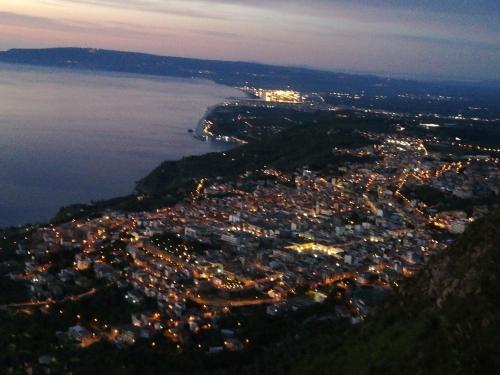 an aerial view of a city at night at Appartamento City in Palmi
