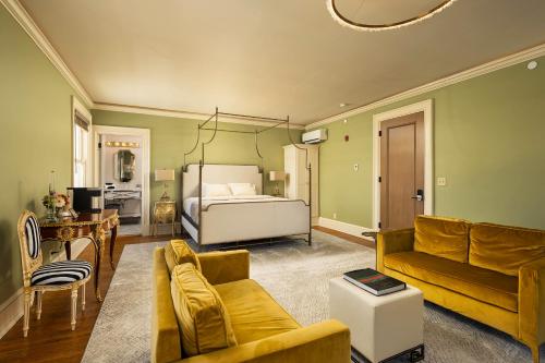 a living room with a bed and a couch at The Edward Buffalo in Buffalo