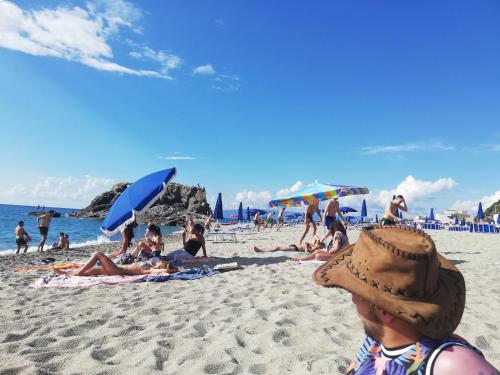 a group of people laying on the beach at Appartamento City in Palmi