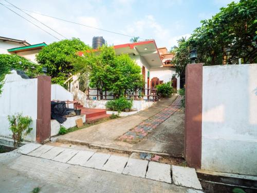an empty street in front of a house at Surfing Guest House in Matara