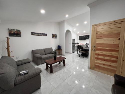 a living room with a couch and a table at Cabañas el Pino 2 in Creel