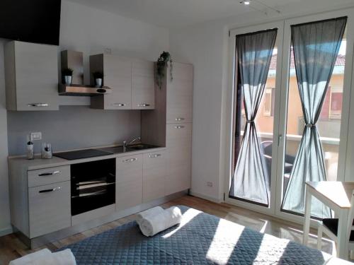 a kitchen with a sink and a stove top oven at suite room malpensa b&b in Cardano al Campo