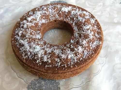 a chocolate cake with powdered sugar on a plate at Palazzo Muro Leccese Relais de Charme & Wellness in Muro Leccese