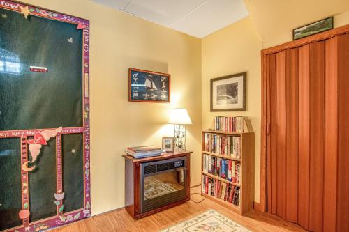 a room with a chalkboard and a book shelf at RTLCMP Lakehouse in Arbor Vitae