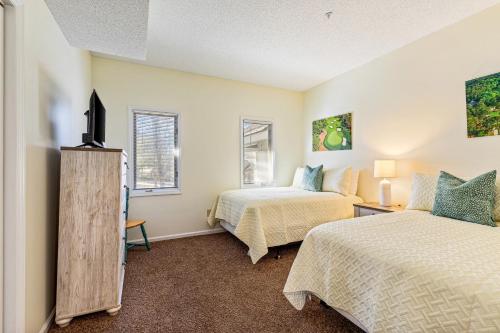 Ένα ή περισσότερα κρεβάτια σε δωμάτιο στο Tidewater Condos
