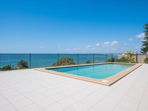 a swimming pool on the roof of a house at Edgecliffe Unit 4 4 Esplanade Kings Beach in Caloundra
