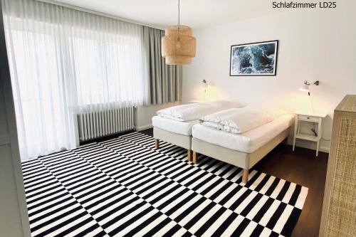 Ein Bett oder Betten in einem Zimmer der Unterkunft Haus Lieke Deeler