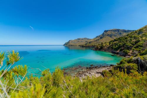 a view of a beach with blue water at Can Petit Estel in Colonia de Sant Pere