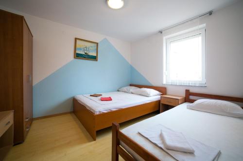 Postel nebo postele na pokoji v ubytování Ari Apartments