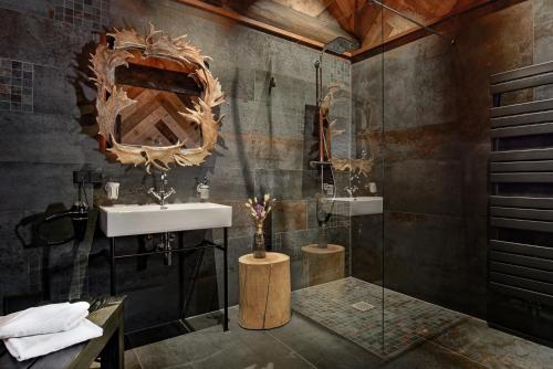 a bathroom with a sink and a shower at Timberjacks Kassel Motel in Kassel