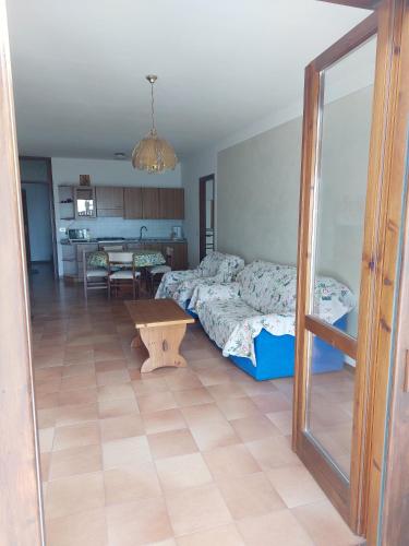 a bedroom with a bed and a table at Appartamento Gio B in Tignale